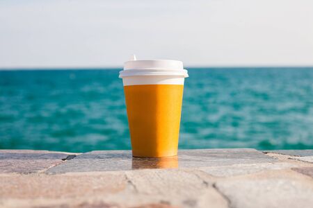 Yellow cup of tea or coffeeの写真素材