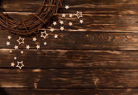 Christmas wreath with wooden stars on  rustic background.の写真素材