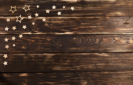 Wooden background with christmas  stars in the corner.の写真素材