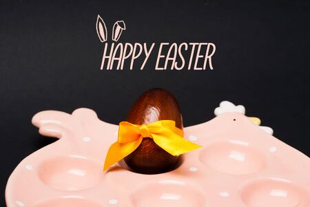 Easter card: Chicken, egg with yellow bow. Happy easter holiday conceptの写真素材