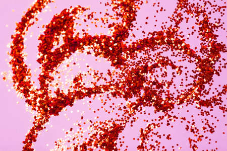 Golden glitter bokeh on pink background.の写真素材