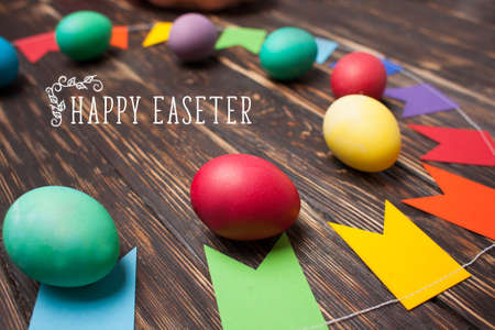 Easter eggs and holiday decorations on a wooden background. Colorfulの写真素材