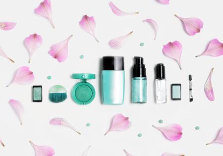 Beauty, decorative cosmetics. Makeup brushes set and color eyeshadow palette on white background, flat lay, top viewの写真素材