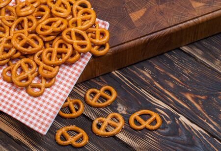 Brezeles on wooden background, close upの写真素材