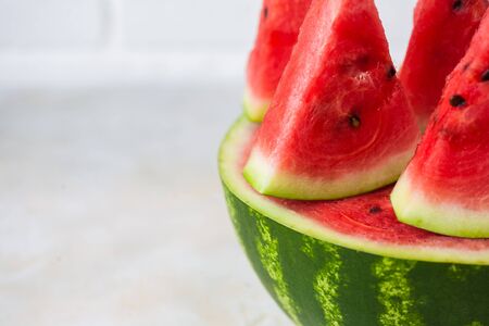 Macro of Watermelon slices on white brick wall background. close upの写真素材
