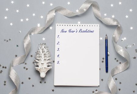 Notebook with pen and christmas decoration, balls, snowflakes. Copy space. Space for your text. Close up, top view.の写真素材