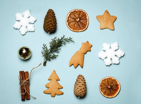 Christmas geometric minimalism: cookies, cinnamonmoon, fir cones. top view flat lay