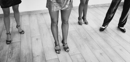 Dancer's legs on dancepole in black and white.の写真素材