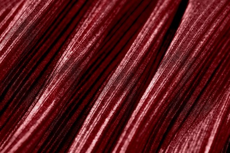 Red pear colored fabric texture, close up, top viewの写真素材