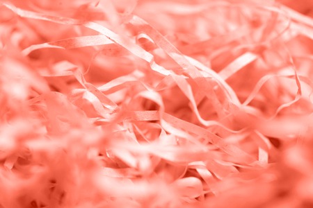 Living Coral Crumpled paper texture. Flat lay, top viewの写真素材