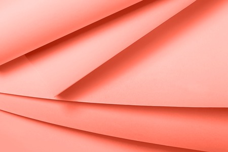 Living Coral colored paper background, soft pastel colors. Place for text. Color of the year 2019...