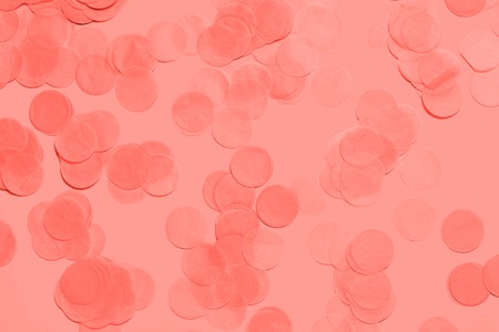 Living Coral pastel confetti and sparkles background, golden stars. Bright and festive. Color of the year 2019 16-1546. Copyspace for text.の写真素材