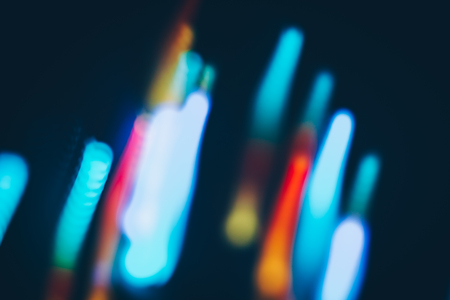 Magic lights christmas bokeh on black background. Can be used for your photos.の写真素材