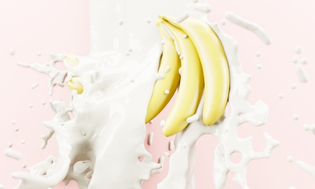 Spilled milk on bananas. Splashes and spray. Minimal sweet desert concept.の写真素材