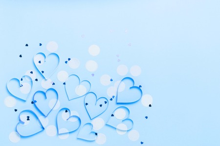 Valentine's day greeting card with beautiful pure blue hearts and confetti. Lovely Happy Valentine's day minimal concept. top view, flat lay.の写真素材