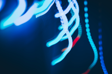 Magic lights christmas bokeh on black background. Can be used for your photos.の写真素材