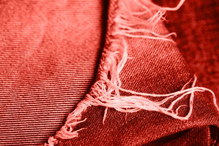 Stack of jeans on table. Zero vaste concept. Ecology and recycling. Living coral concept.