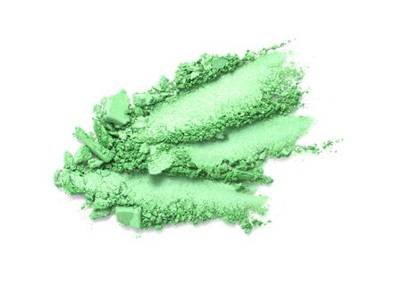 A broken green colored eye shadows isolated on a white background. Top view, flat lay. Copy space for your textの写真素材