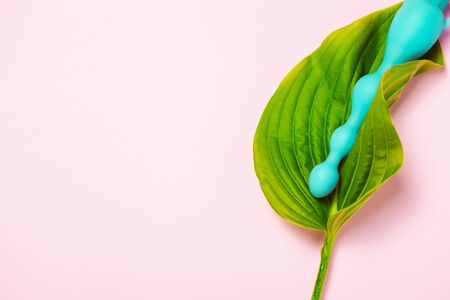 Adult sexy toy in green pure leaf.