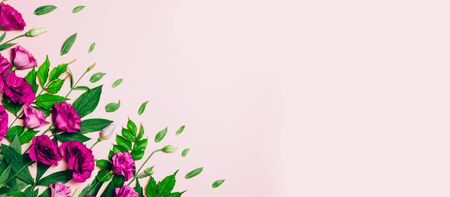 Yellow Lisianthus pattern on pink background. Top view, flat lay. Creative flower background.