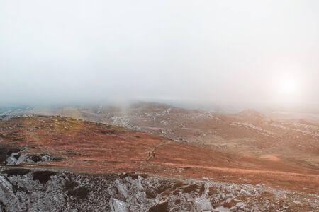 Foggy mountain landscape. Autumn weather.
