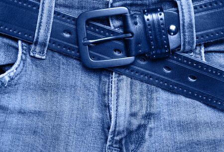 Stack of jeans on table.の写真素材