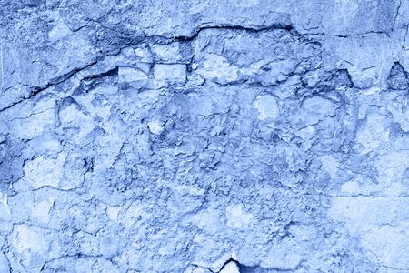 colored in color of year 2020 Classic Blue background. grunge textured wall. Abstract Blue cracked...