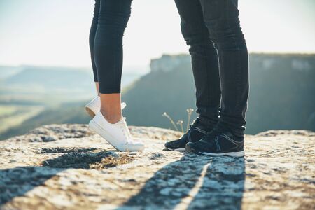 Young beautiful couple walking outside on beautiful sunset.