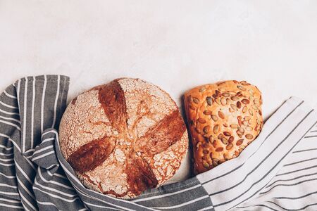 Different kinds of bread on white backdround. Top view, flat lay.の写真素材