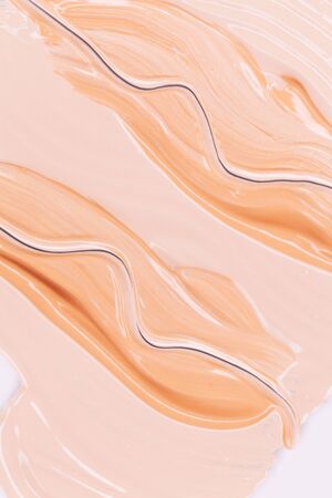 Makeup foundation smudges isolated on white background. Top view, flat lay.の写真素材