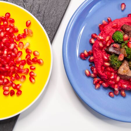 Chiken liver and hummus dish on white table.の写真素材