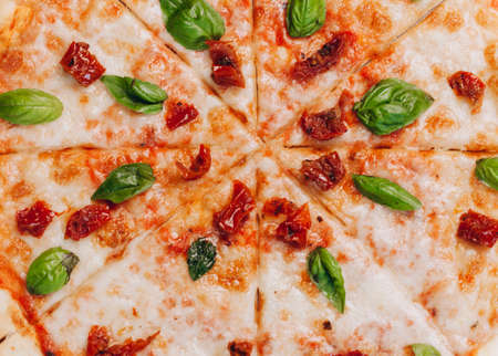 pizza margarita with sun-dried tomatoes. Tasty traditional italian cuisine.