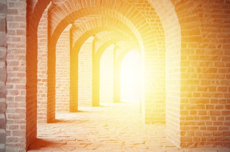 old stone arches and sunshineの写真素材