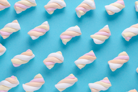 marshmallow pattern on blue background, pastel colorsの写真素材