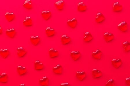 red background with hearts pattern, flat layの写真素材