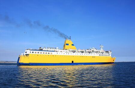 Yellow cruise ship leaves portの写真素材