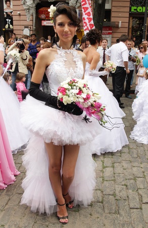 ODESSA,UKRAINE  MAY 27: Annual event  Bride Parade. Happy excited participants in fiancees gowns take part in celebration of marriage and romance Bride Parade on May 27, 2012 in Odessa,Ukraineのeditorial素材