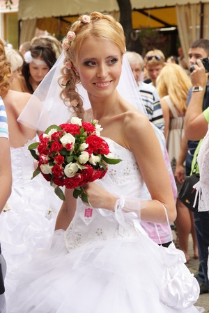 ODESSA,UKRAINE  MAY 27: Annual event  Bride Parade. Happy excited participants in fiancees gowns take part in celebration of marriage and romance Bride Parade on May 27, 2012 in Odessa,Ukraineのeditorial素材