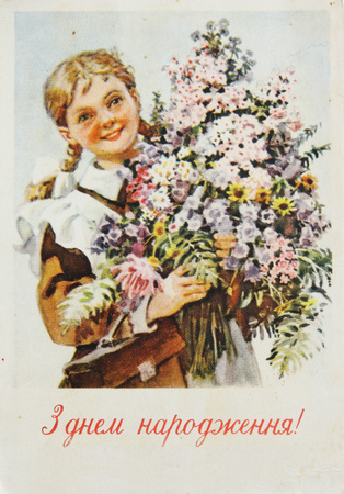 USSR-circa 1960s : Soviet postcard shows  a girl with bouquet of flowers , text in ukrainian Happy birthdayのeditorial素材