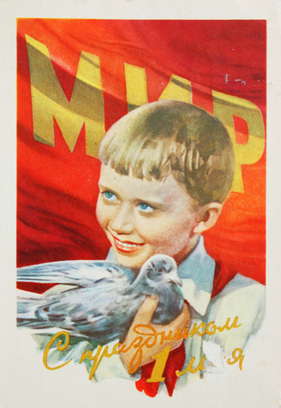 USSR-circa 1950s : Soviet postcard shows  a boy with dove devoted May day, text in russian  May day 1stのeditorial素材