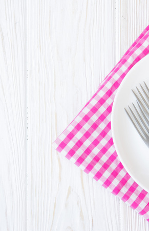 empty plate on a wooden backgroundの写真素材