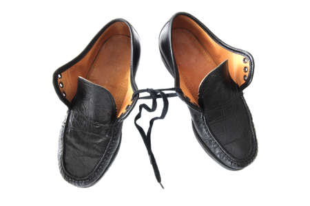 old black leather shoes isolated on white