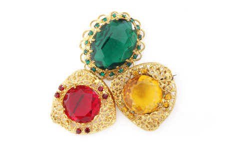jewelry brooches with gems isolated on a white background.の写真素材