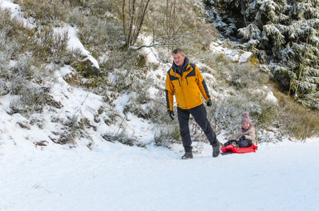 Winter Fun Sledding Snowy Landscapeの写真素材