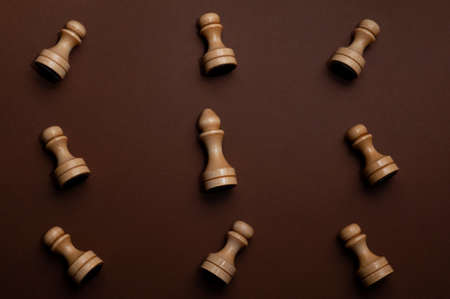 set of chess on brown background top view