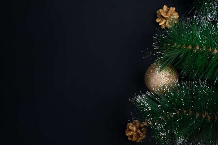 New Year card, fir branch with golden Christmas ballsの写真素材