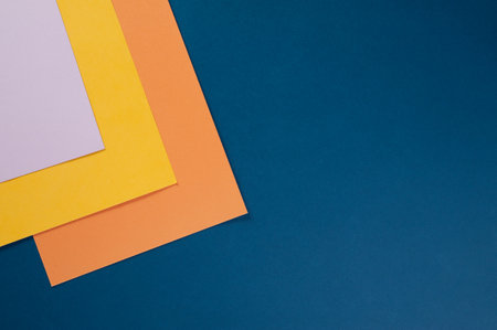 sheets of colored paper for creativity on the table