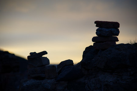 Pile of stones on the top of the mountain in the evening