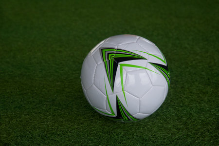 Soccer ball on green grass background. close-up image.の写真素材