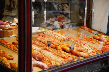 Coffee shop window with croissants and sausagesの写真素材